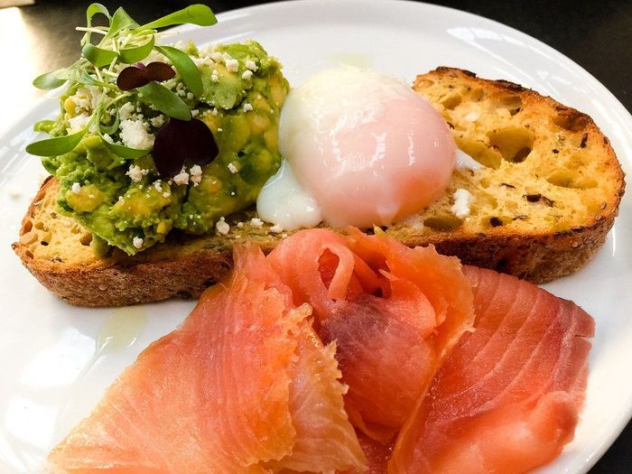 Salmon with poached egg and avocado on toast