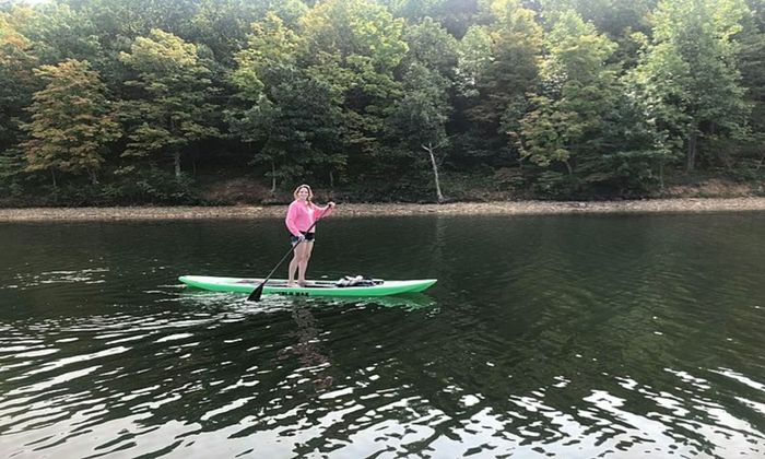 girl standing on a paddelboard