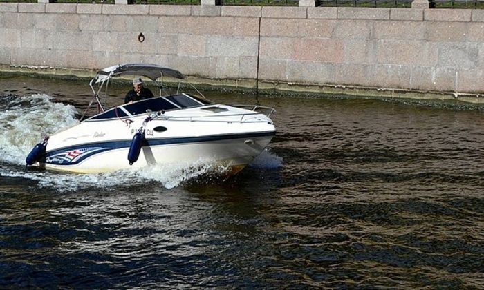 sport boat, angler maneuvering the boat