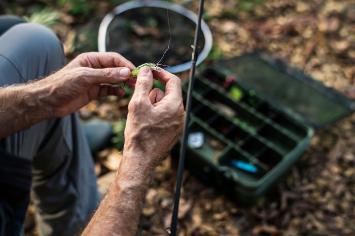 closeup-fisherman-putting-bait.jpg