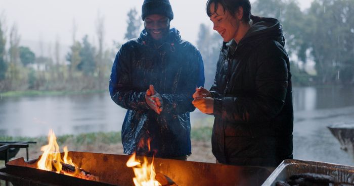 couple-hands-bonfire-outdoor-with-rain-warm-camp-adventure-winter-getaway-holiday-man-woman-together-with-fire-fireside-connection-happiness-lakeside-with-flame.jpg