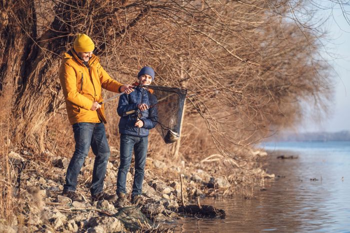 father-son-are-fishing-sunny-winter-day-they-caught-fish (2).jpg