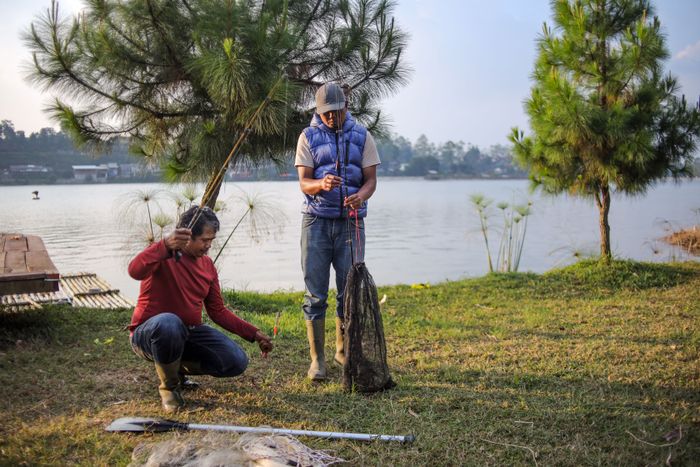 fishermen-are-lake-shore-preparing-their-fishing-gear-with-lake (2).jpg