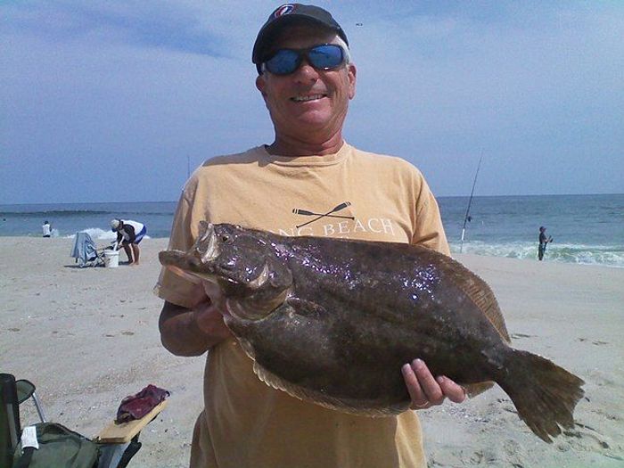 angler holding a huge southern flounder