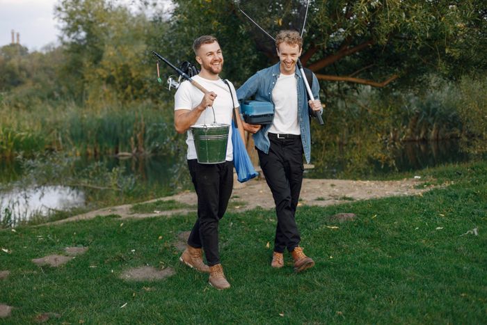 friends-is-ready-fishing-men-holding-fishing-equipment.jpg