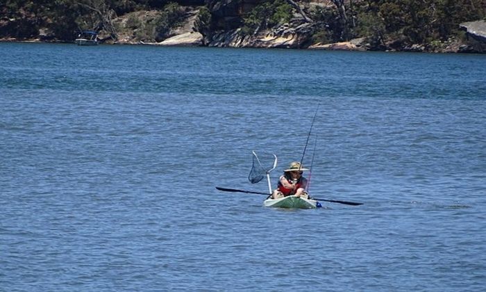 kayak fishing, woman angler, river, blue water