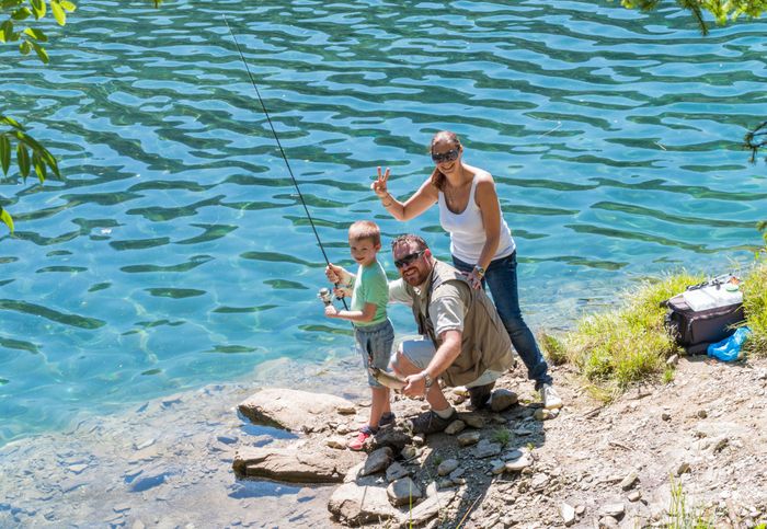 happy-family-is-fishing-together-river-mountain.jpg