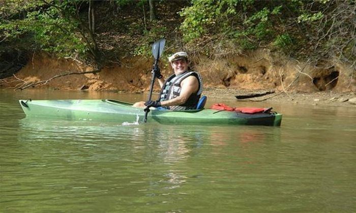 man kayaking in lake norman