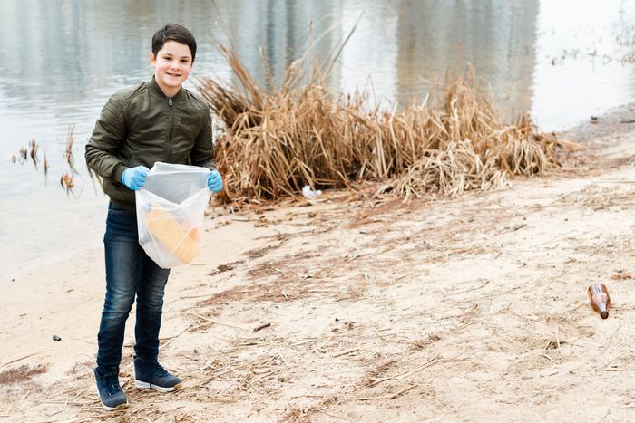 long-shot-boy-with-plastic-bag.jpg