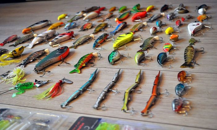 colored lures on the wooden table