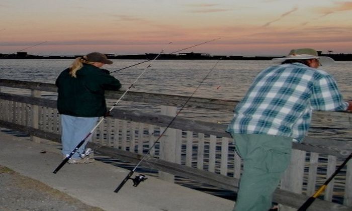 man and woman fishing at night, fishing rods