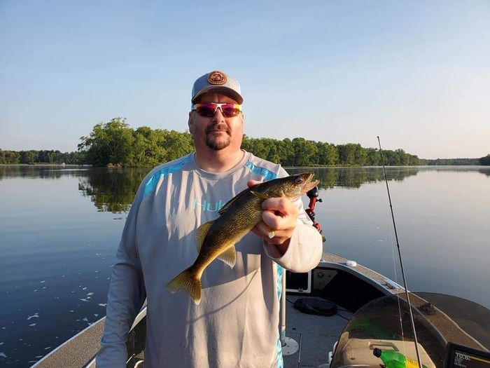 man holding a fish in his hand