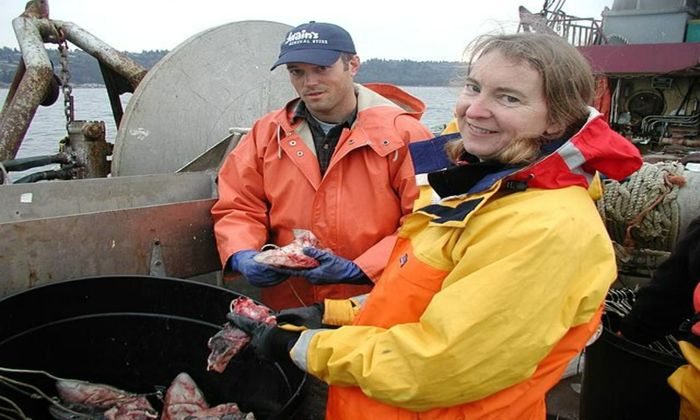 man and women preparing baits for fish