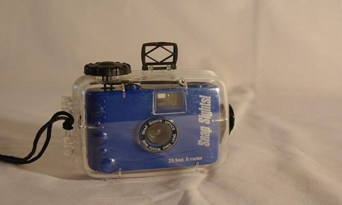 blue camera inside a waterproof case