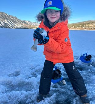 Big smiles and a feisty Rainbow Trout!