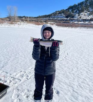 Beaming with a gorgeous Rainbow Trout!