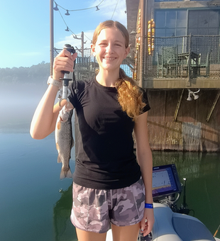 Jigging for rainbow trout in Branson's stormy skies!