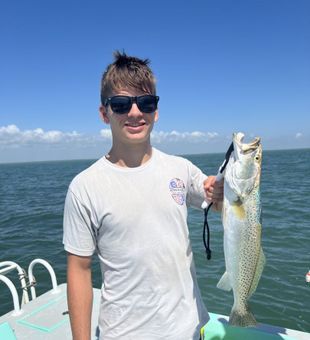 Professional fishing guide in South Padre Island, Texas helping anglers land quality catches.