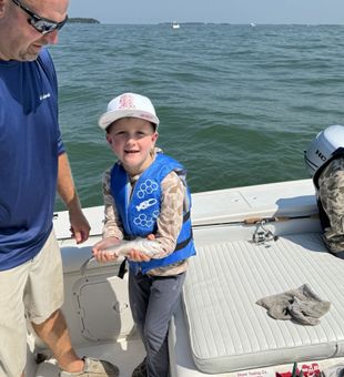 Early morning Lake Erie Ohio fishing trip—reeling in success.