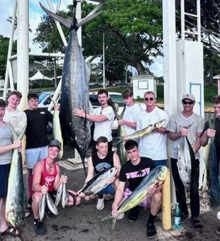 Reeling in Striped Marlin in Haleiwa's deep sea!