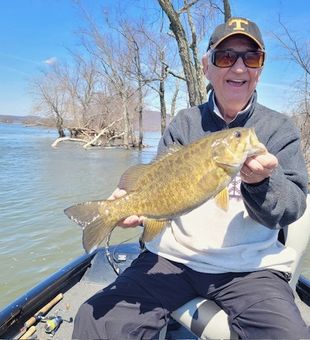 All Smiles Showing his Trophy Smallmouth bass!