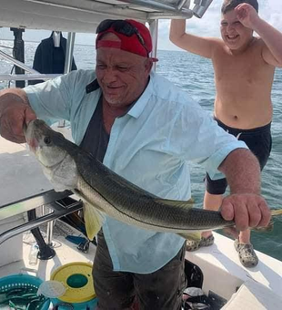 Beautiful Bayport snook brought to the boat!