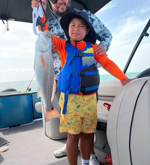 South Padre Island redfish making memories on the water!