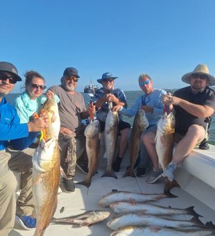 Anglers enjoying an unforgettable Galveston Bay fishing trip on the beautiful Texas coast.