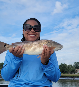 Light tackle triumph: A 19-inch redfish in stormy Jacksonville!