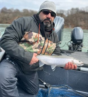 Captain Joe Srouji from Anglers Edge Outdoors with a Steelhead on the Niagara river.