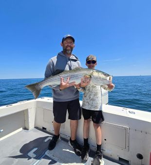 Enjoy a premium striped bass fishing adventure in Wells, Maine, tailored for anglers of every skill level.