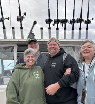 Smiling on this Lake Michigan charter!
