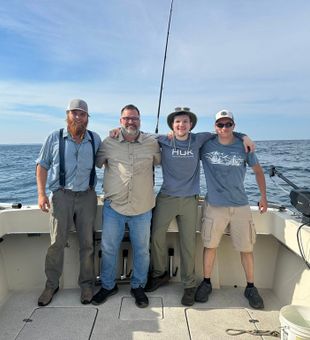 Angler reeling in trout Lake Michigan