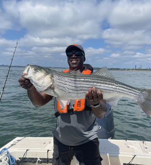 Landed a massive striped bass with some epic fishing techniques in Boston!