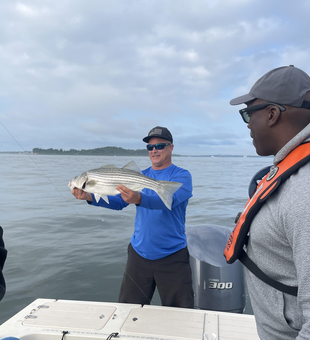 Reeled in a feisty striped bass in the bustling city of Boston!