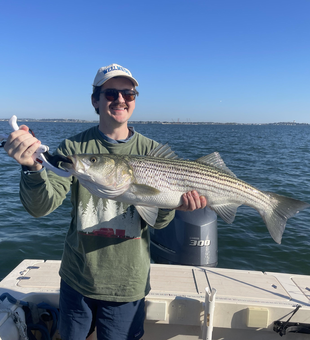Nice striped bass caught using deep sea jigging and trolling techniques in clear conditions!