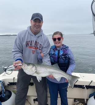 Hooked a mighty striped bass with expert deep sea fishing techniques!