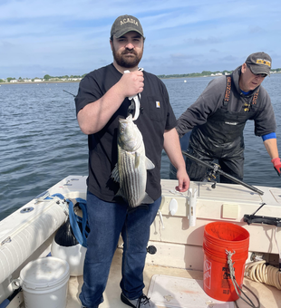 Reeled in a 13-inch striped bass with a variety of techniques on a partly cloudy day!