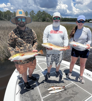 Double redfish delight in Milton's clearing skies!