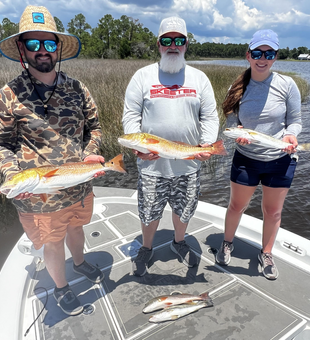 Redfish double-header in Milton FL as the clouds part!