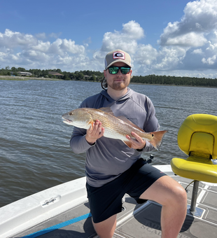A fantastic catch of a beautiful 18-inch Redfish!