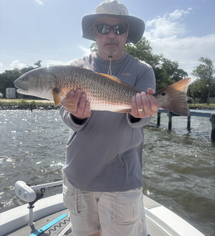 Caught a tasty redfish while jigging, fly fishing, and using heavy tackle on a partly cloudy day with afternoon rain.
