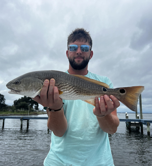 Clearing skies set the stage for epic redfish action in Milton!