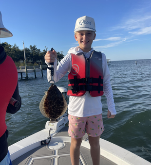 Nice Southern flounder using jigging and fly fishing techniques in clear conditions!