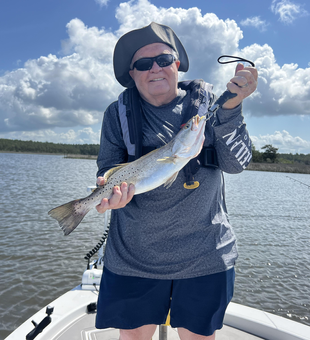 Battling the Spotted Weakfish on a partly cloudy day - a fishing adventure to remember!