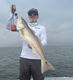 Beautiful Rockport redfish hauled up from the depths!