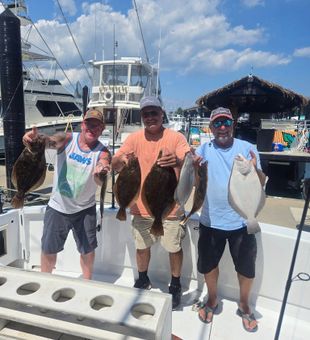 Big flounder action on our fishing charter!