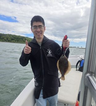 Fluke catch and thumbs-up vibes!