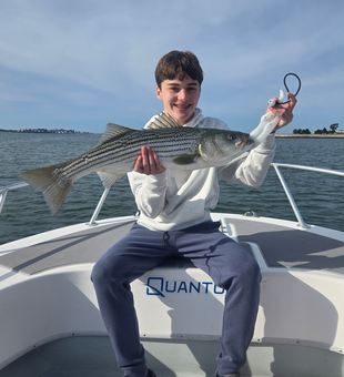 Nice striped bass caught using multiple techniques in partly cloudy conditions off Winthrop!