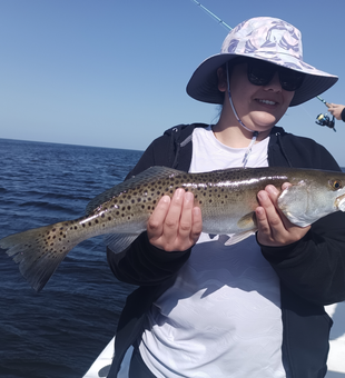 Catching the big one out on the open sea.